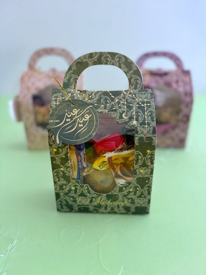 Eid Elegance Box – Golden Patterns – Front view of closed gift box held in hand with Eid Said tag