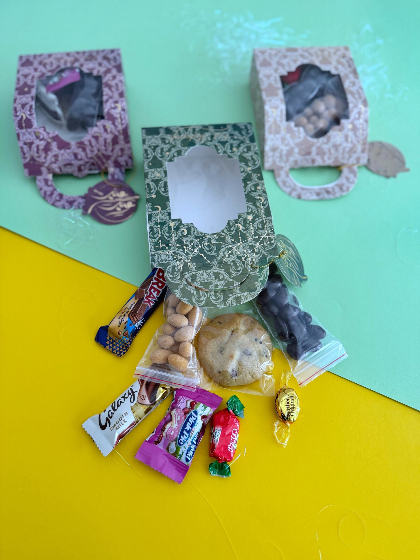 Eid Elegance Box – All three variants in Golden, Pink, and Purple with contents laid out in front