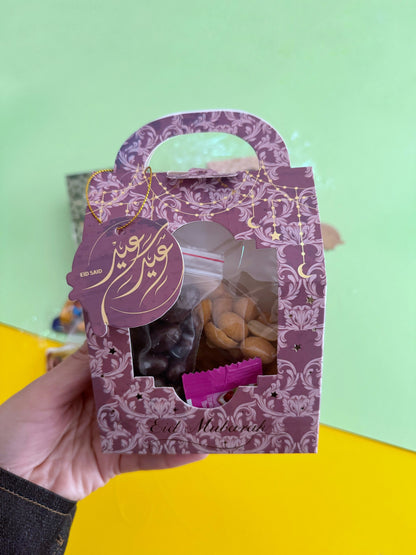 Eid Elegance Box – Purple Patterns – Front view of closed gift box with Eid Said tag, Pink and Golden variants in background
