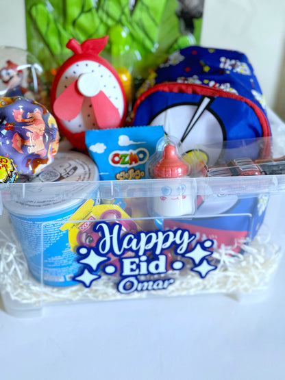 Eid Hero Box - Boy displayed with all included items, such as snacks, toys, a character-themed backpack, and a customized storage box.