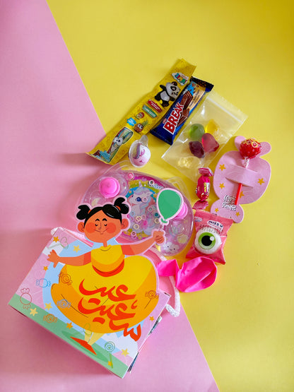 Close-up of the girl variant Eid Joy Bag, showcasing the colorful treats and a playful toy.