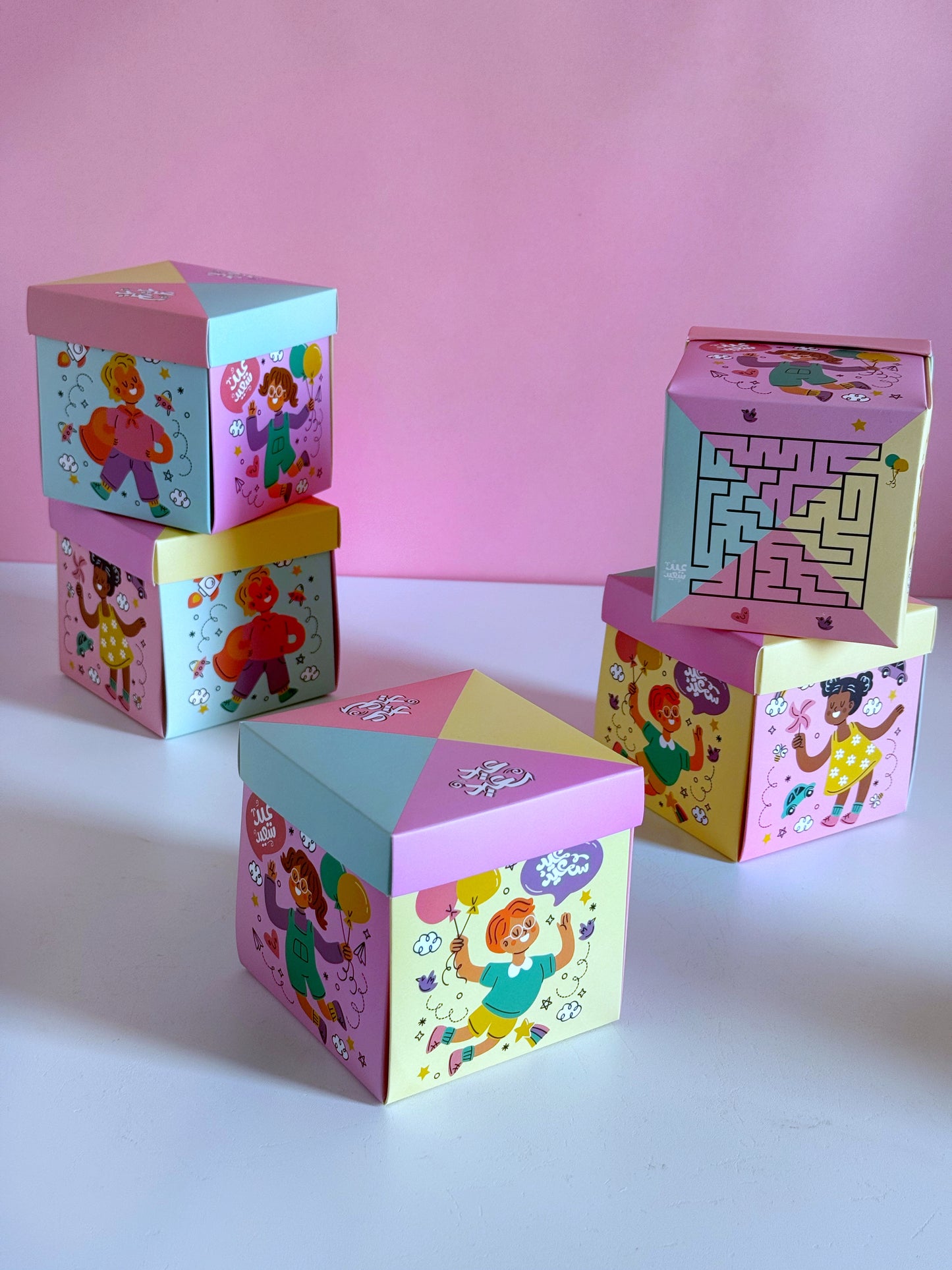 Eid Maze Box stacked in a playful display, featuring colorful illustrations and a built-in maze game.