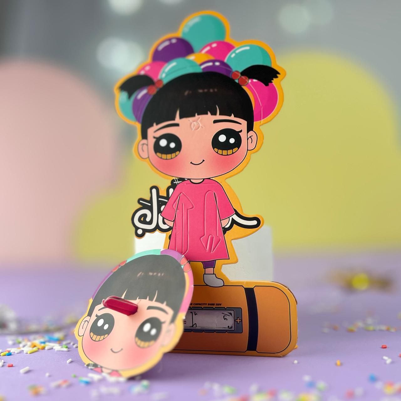 A colorful Eid money card featuring a girl character with balloons, transforming into a toy with a rotating mechanism.