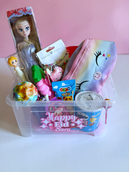 Eid Princess Box - Girl featuring a Frozen doll, unicorn bag, bouncing ball, Pringles, sweets, and toys in a personalized transparent Eid gift box.