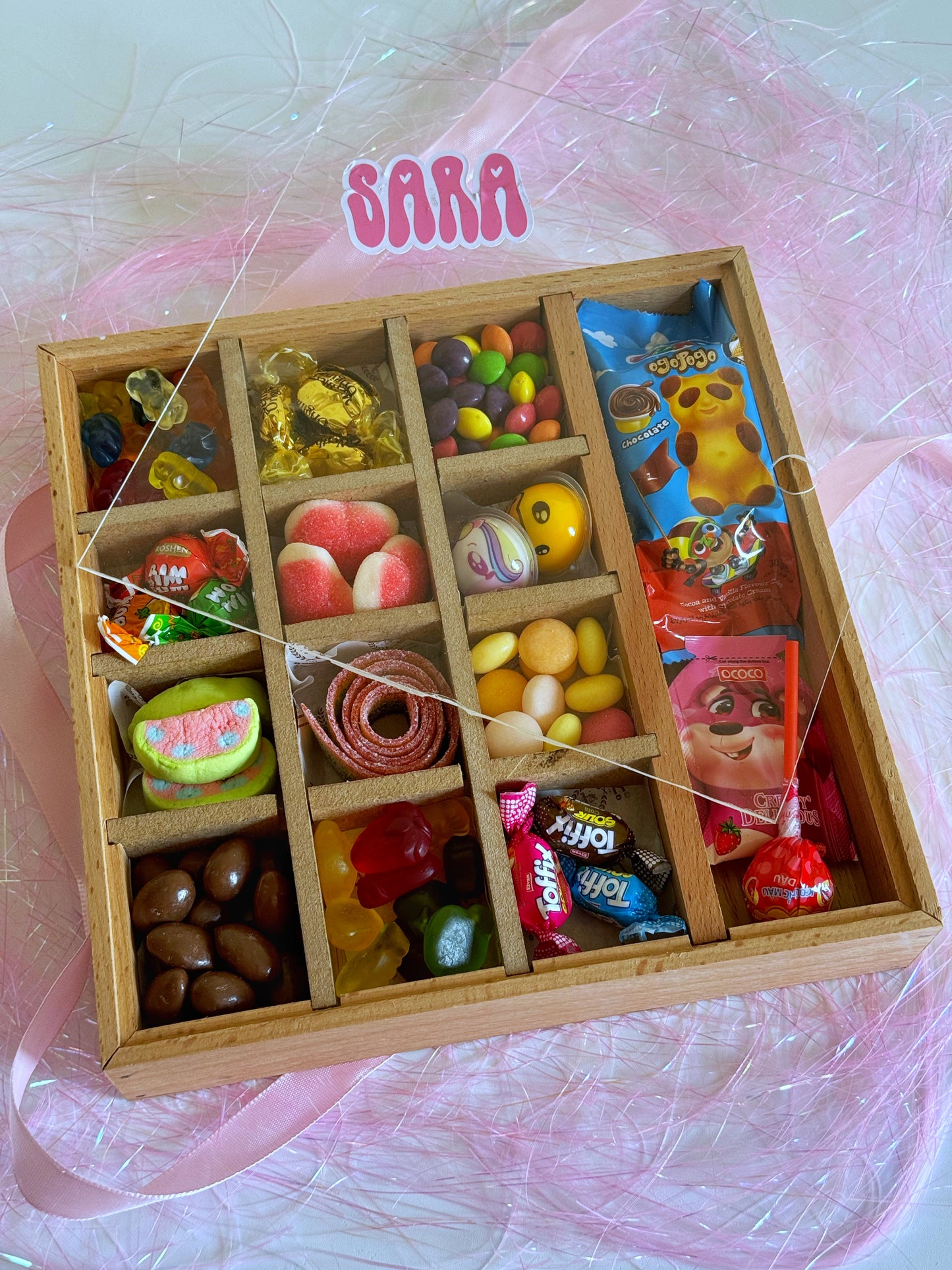 Close-up of the Festive Sweets Chest - Girl, showcasing colorful candies, marshmallows, and chocolates in a beautifully crafted wooden box.