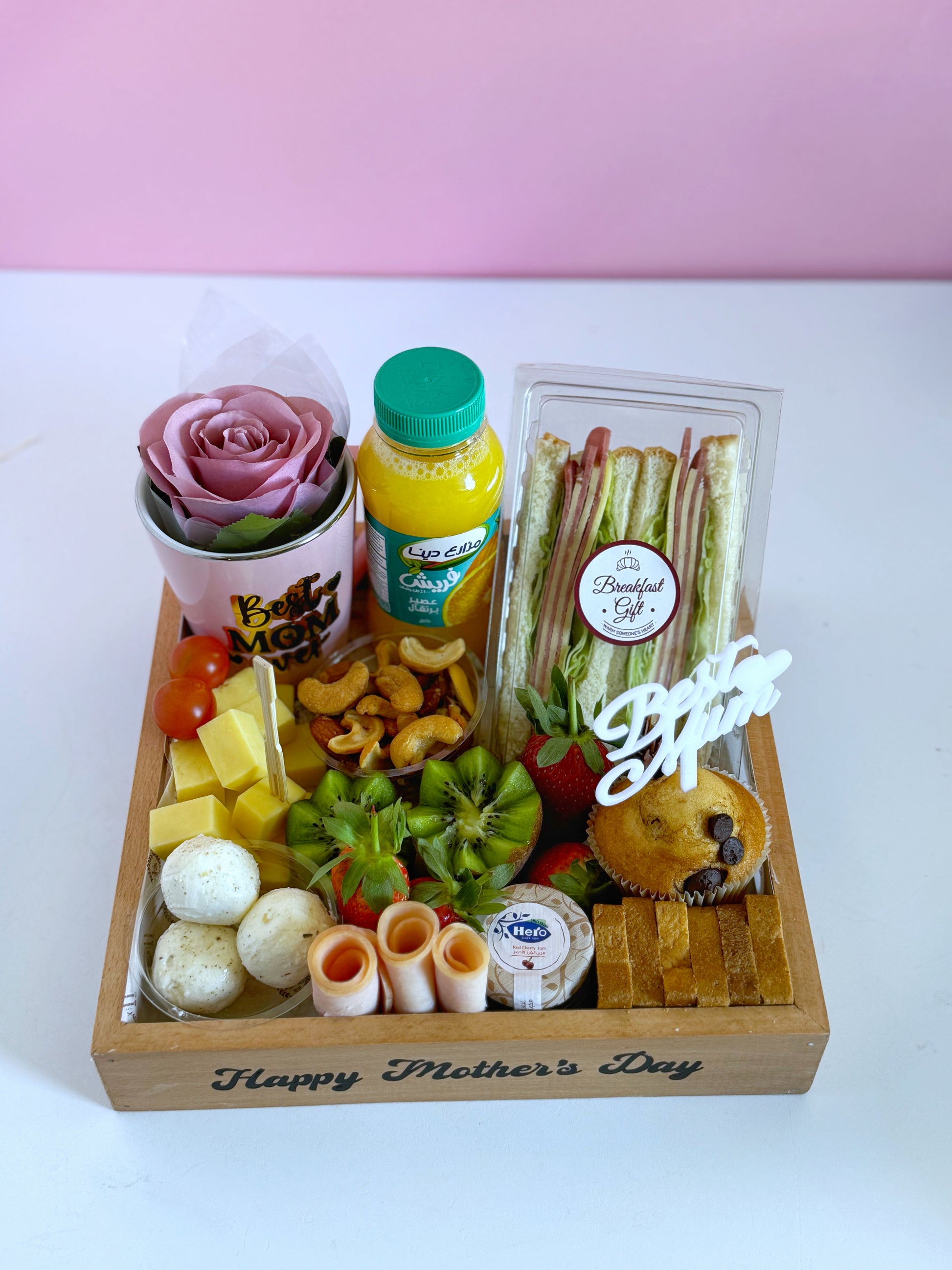 A top angle of the Mother’s Day Breakfast Tray, highlighting the club sandwich, muffin, and “Best Mom Ever” mug for a perfect morning surprise.