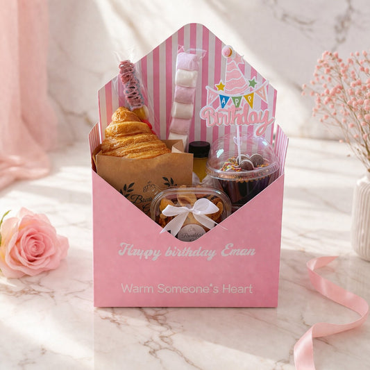 Sweet Birthday Envelope – Open box showing croissant, cupcake with Birthday topper, nuts, juice, candy and marshmallow skewers
