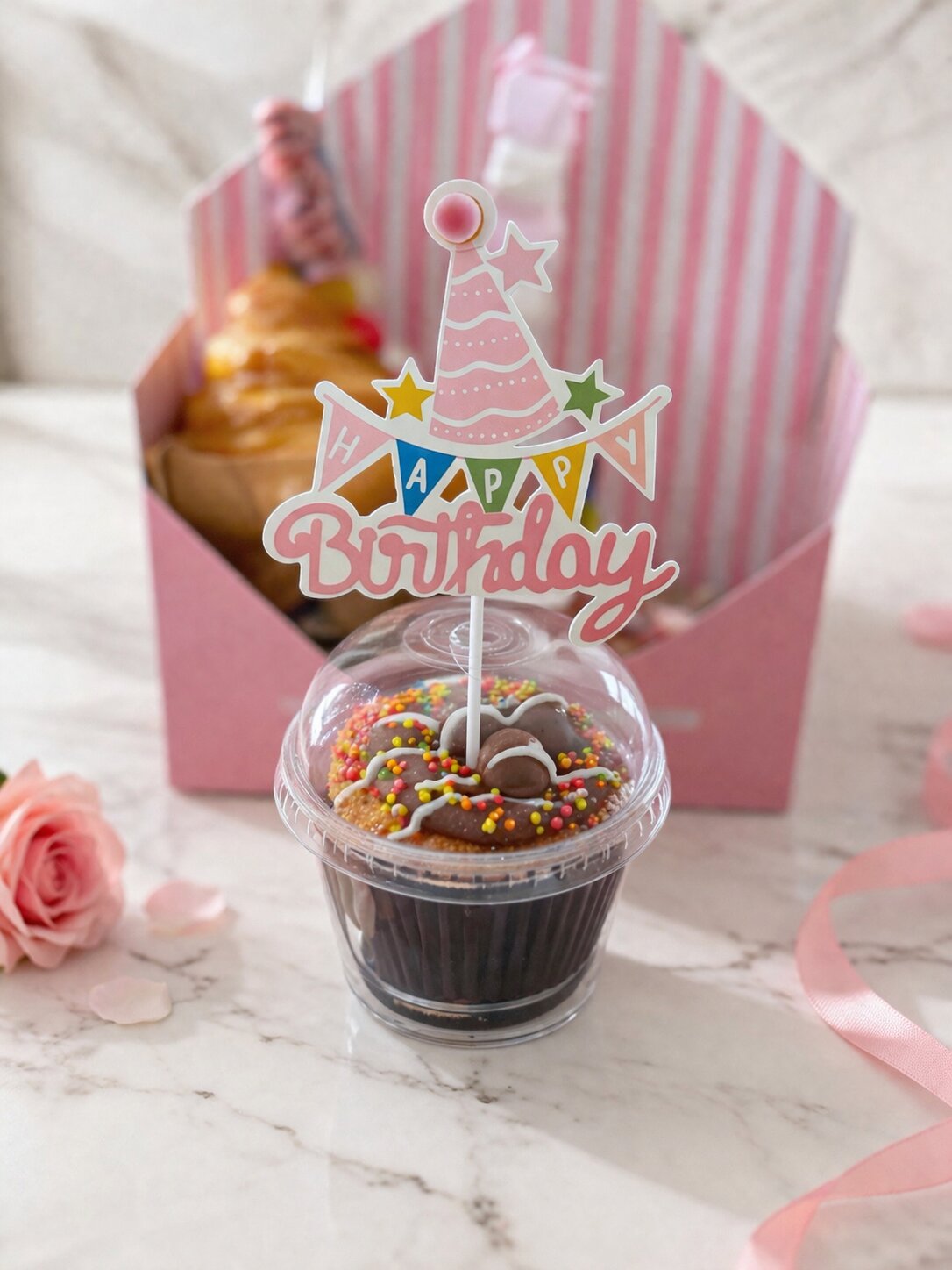 Sweet Birthday Envelope – Close-up of chocolate cupcake with colorful sprinkles and Happy Birthday party hat topper