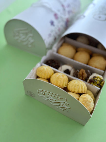The Grand Kahk Box – Close-up of open tray showing Ghraybeh, Plain Kahk, and assorted Petit-Four with dark and white chocolate