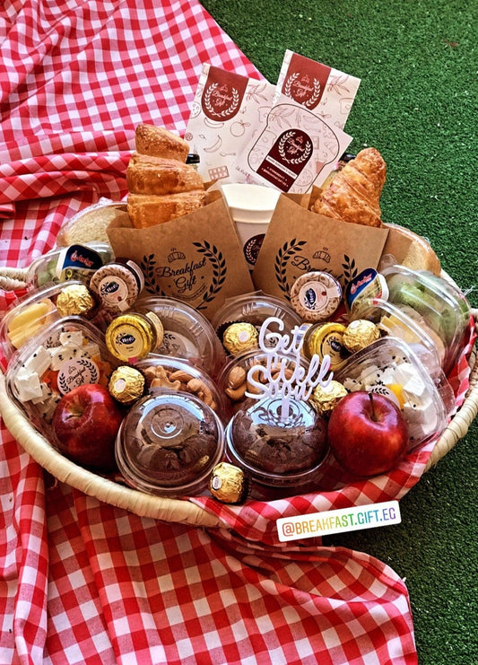 Get Well Soon Breakfast gift basket beautifully arranged with croissants, toast, muffins, fresh fruits, honey, jam, cheeses, chocolates, natural juices, and a 'Get Well Soon' topper. A perfect way to send warm wishes and brighten someone's day.